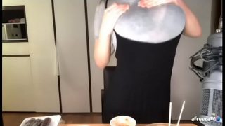 Korean babe fondling her boobs through clothes